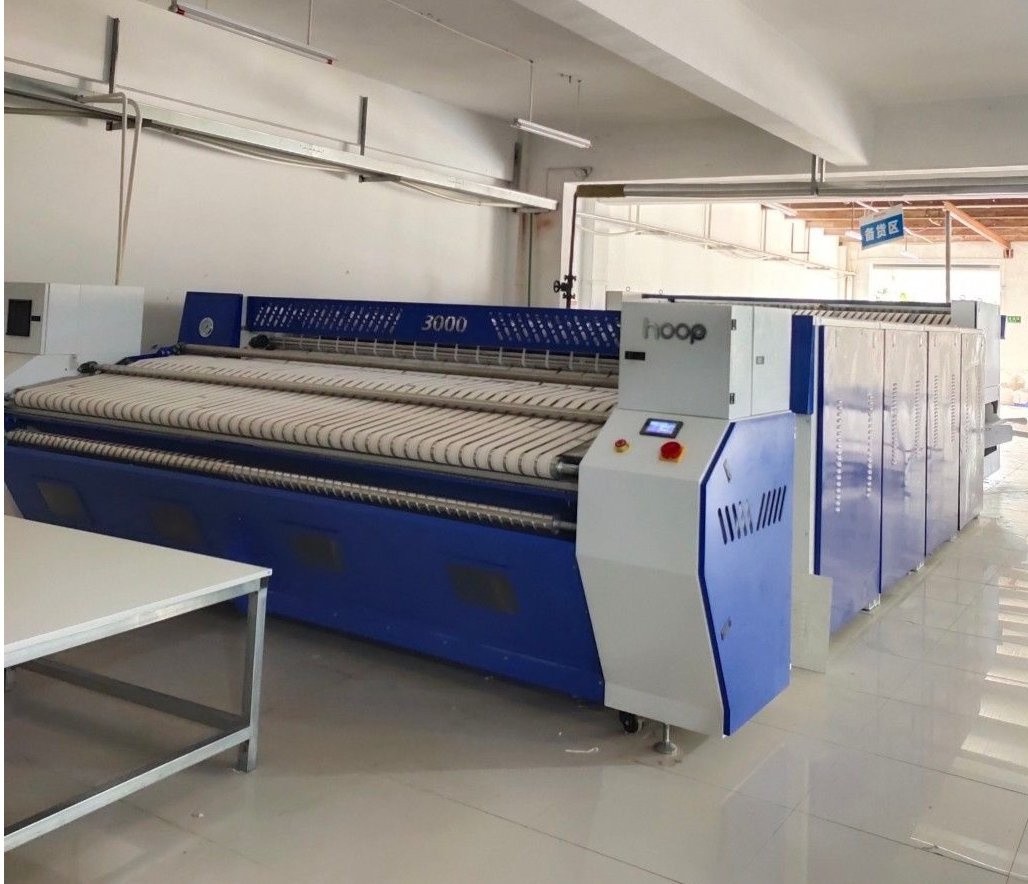 Manual feeder, ironer, and folder line