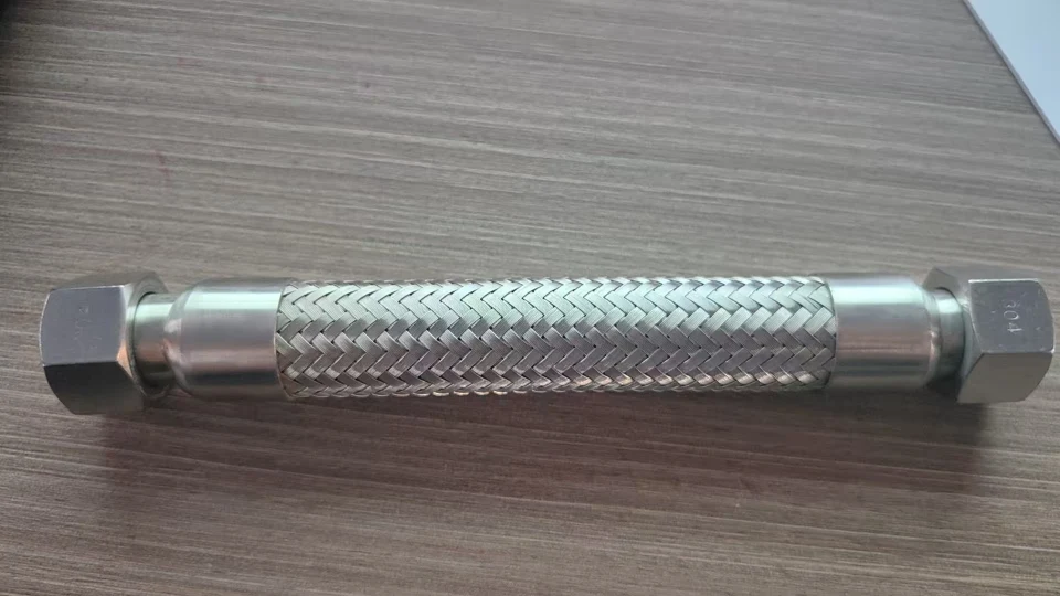 A single SS304 braided flexible hose assembly with nut ends on both sides